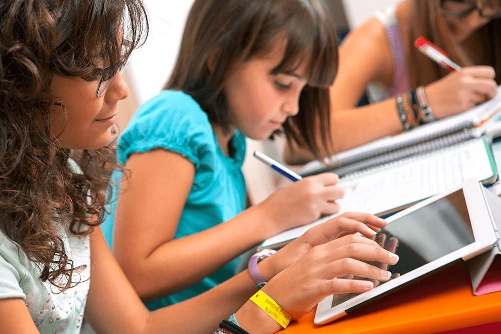 teacher and student at desk