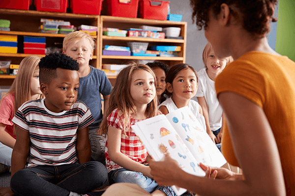 teacher reading aloud to class