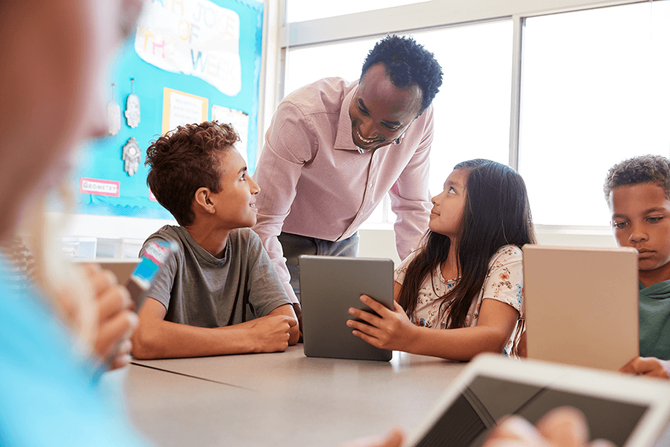 teacher discussing lesson with students