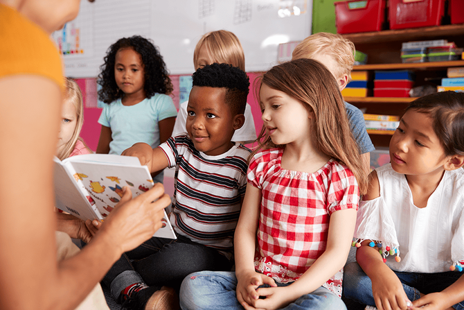 teacher reading aloud to class