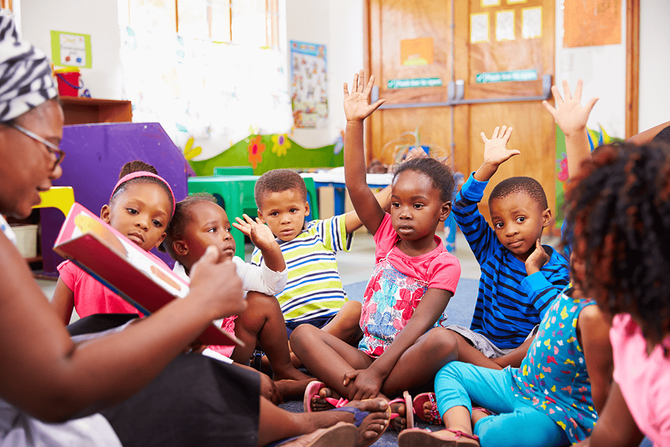 teacher reading aloud to class