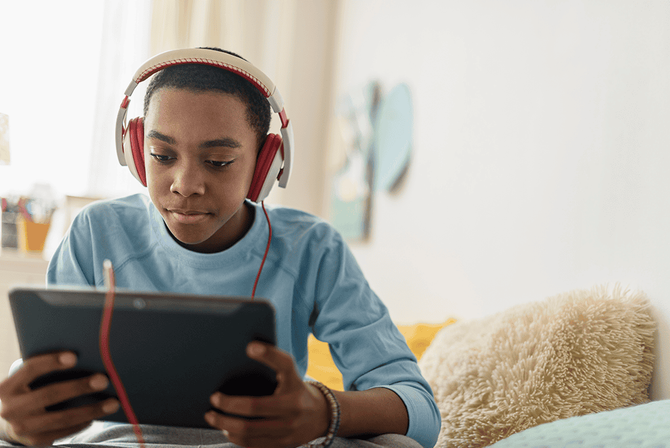 middle school student working on a tablet